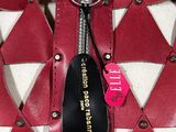 a close up of a purse with a tag on it