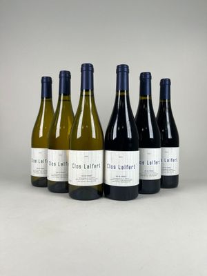 six bottles of wine are lined up in a row