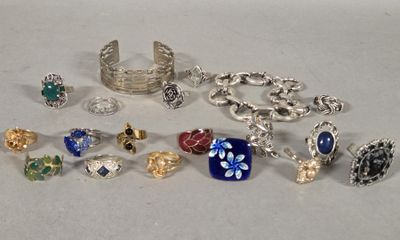 a lot of different rings and bracelets on the table