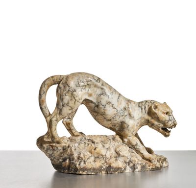 an image of a statue of a leopard on a rock