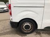 a white van that is parked in a parking lot