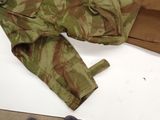 a pair of shoes that are next to a military uniform