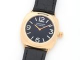an image of a black and gold wrist watch on a white surface