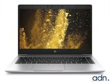 a laptop computer with a gold background on the screen