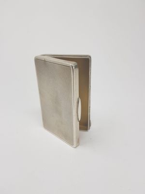 sterling silver cigarette case with a rounded opening