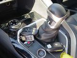 an image of a car ' s gear lever in the center console