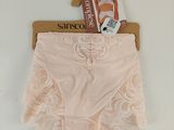 pink panties on a hanger on a white background with a tag