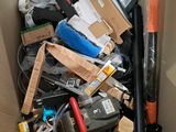 a cardboard box filled with assorted items in it
