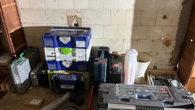 a pile of tools and other items in a room