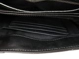 the inside of a black purse with a zipper on it