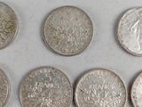 a lot of coins that are sitting on a table