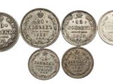 six types différents de pièces d'argent sont représentés sur un fond blanc