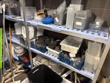 a lot of items on the shelves in the room