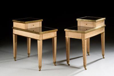 two tables with drawers on each side of them in a dark room