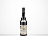 the bottle of wine is sitting on the table with a white background