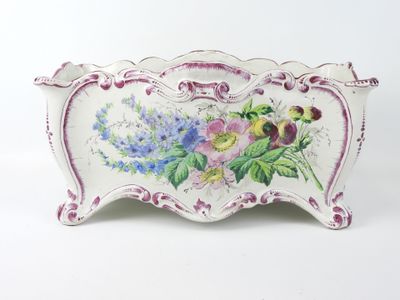 a white box with flowers on it on a white surface