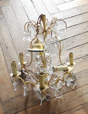 a chandelier that is sitting on a wooden floor