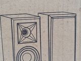 a cardboard box with a drawing of a pair of speakers