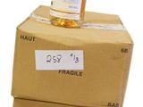 three boxes stacked on top of each other with a bottle of wine on top of them