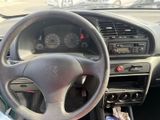 dashboard of a car with a steering wheel and dashboard controls