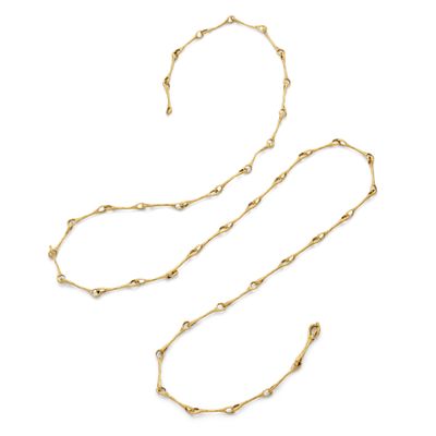 a gold necklace and bracelet set on a white background