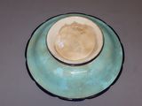 a blue and white bowl and saucer sitting on a table