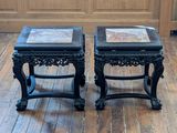 two tables that are sitting on a wooden floor