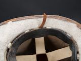 a close up of a hat with a cross on it