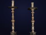 a pair of antique brass candlesticks