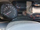 a close up of a car dashboard with a speedometer and gauges