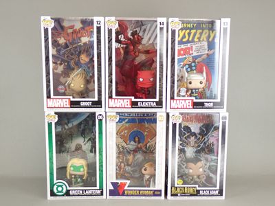 a lot of comics on display on the table