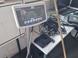 a laptop computer sitting on a table next to a computer monitor