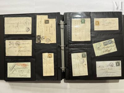 a black binder with a lot of old letters and stamps on it