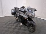 a motorcycle that is parked on a checkered floor