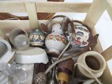 a wooden box filled with assorted items on a table