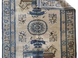 an oriental rug with a blue and white design on it