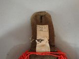 a brown teddy bear with a tag on it ' s back