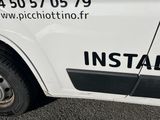 a white van that is parked on the side of the road