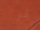 a close up of a brown leather wallet on a white background