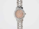 an image of a woman ' s wrist watch with a pink dial