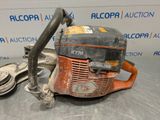 a chainsaw with a chain attached to it on a table