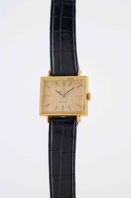 a close up of a watch on a black strap on a white background