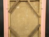 an old picture frame with a piece of wood in the middle of it
