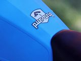 close up of a blue motorcycle with a logo on it