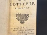 an old book opened to show the title of a poem