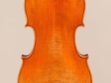 an old violin with a wooden back and a long neck