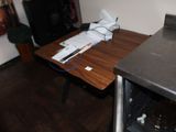 a small table with a bottle of water on it