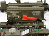 many toy soldiers standing on top of a train
