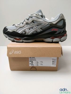asics gel - kayano running shoe in a box on top of a cardboard box