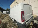 a white van that is parked next to a building